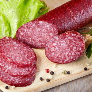 Cut Salami on a cutting board.