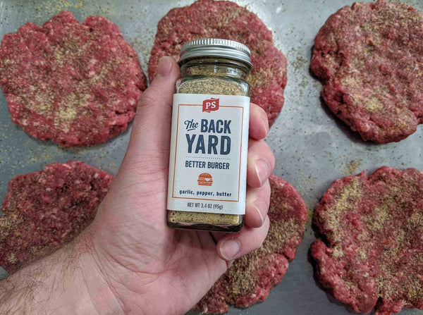 The Backyard being used to season burgers before they hit the grill.