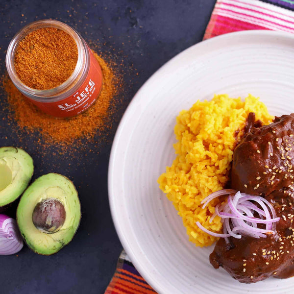 A plate of food that was used with El Jefe - Adobo Honey Taco Seasoning. An open can of El Jefe is on the site of the plate by an avocado.