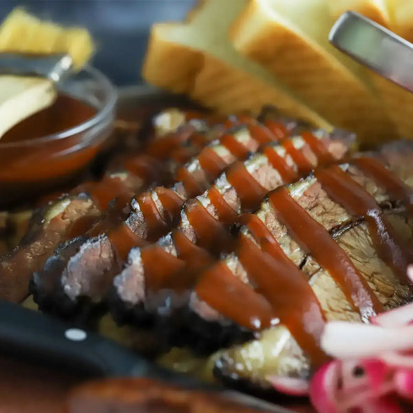 Meat drizzled with Memphis King BBQ sauces