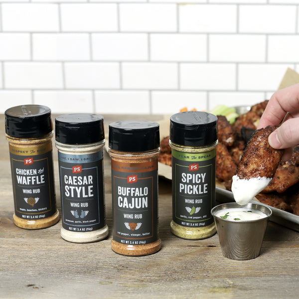 Chicken and Waffle, Caesar Style, Buffalo Cajun, and Spicy Pickle next to a wing being dipped in ranch.