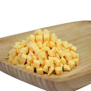 PS Seasoning & Spices High Temp Cheddar Cheese on a cutting board.