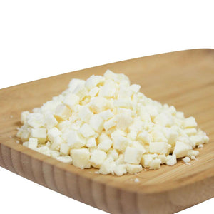 PS Seasoning & Spices High-Temp Mozzarella Cheese sitting on a cutting board.