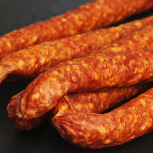 Multiple logs of Mexican Cheddarwurst  ready to be eaten.