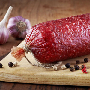Garlic Summer Sausage on a cutting board.