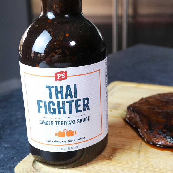 Close up of a bottle of Thai Fighter - Ginger Teriyaki Sauce 