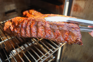 Hot and fast smoked ribs with a caramelized bark ready to serve