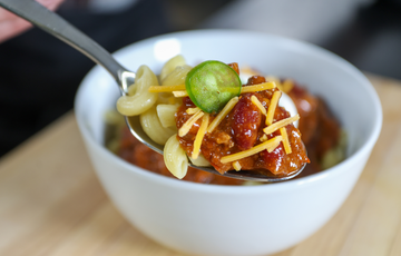 Smoked Venison Chili topped with cheese and jalapenos