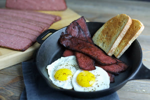 deer bacon cooked with PS Seasoning's venison bacon recipe over some eggs and toast
