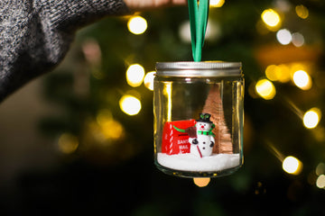 DIY Snow Globe Ornaments from Glass Spice Jars