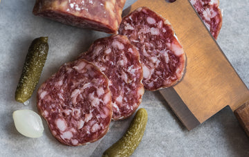 Dry aged charcuterie and salami hanging in a dry ager