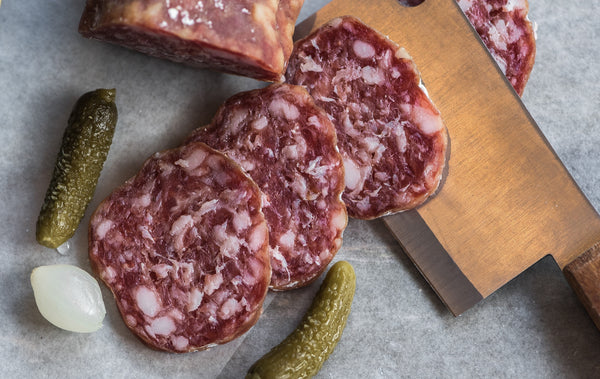 Dry aged charcuterie and salami hanging in a dry ager