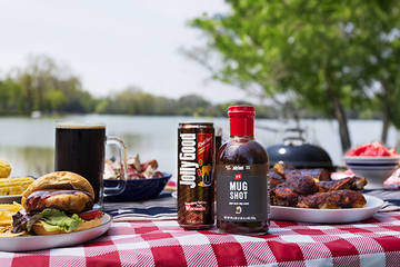 Mug Shot BBQ Sauce on table with Jolly Good Root Beer