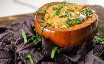 cheesy queso dip in a pumpkin