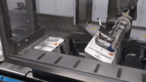 Auto cartoner creating kits in manufacturing setting