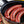 Three Chili Dogs sizzling in the pan.
