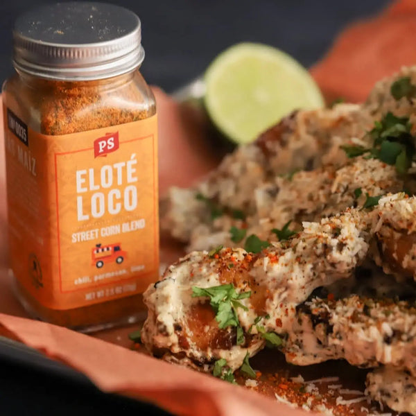 Elote Loco Wings with a jar of Elote Loco next to them