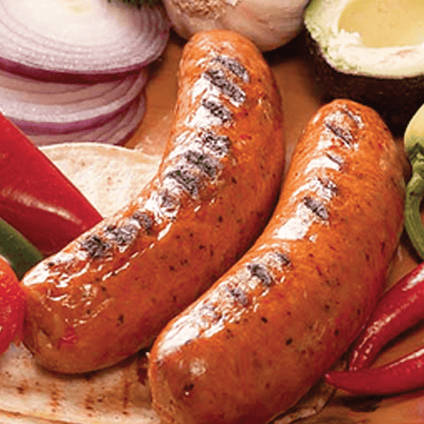 Two Mango Habanero Brats on a bed of ingredients.