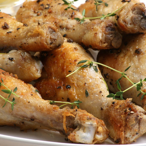 Pile of chicken legs made with PS Seasonings Mock Chicken Flavor
