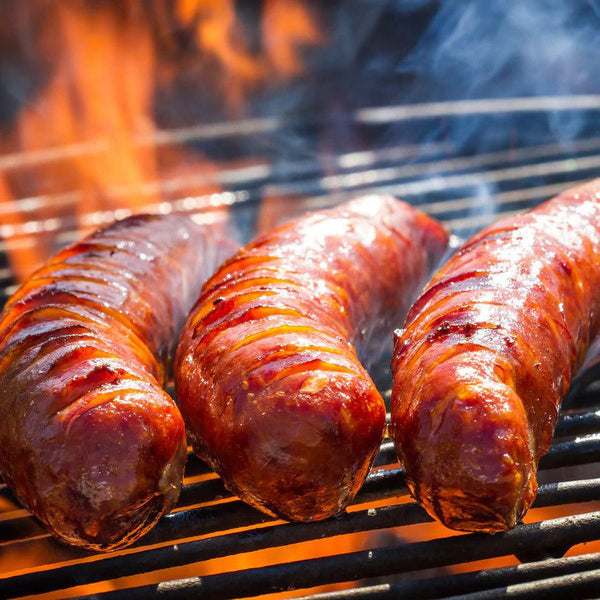 Three Sassy Honey BBQ Brats being fired up on the grill.