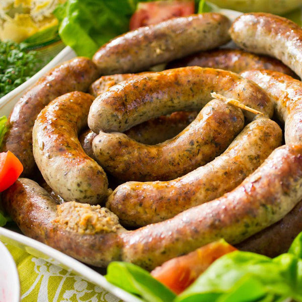 Pile of Polish Sausage surrounded by ingredients.