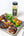 Grilled chicken with lemon and herbs on a tray with a seasoning bottle labeled 'El Dienero'.