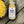 Grate State seasoning blend bottle on a wooden surface with corn.