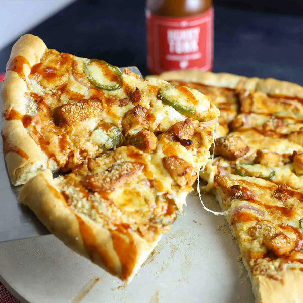 Buffalo Chicken pizza drizzled with Honky Tonk - Nashville Hot Sauce