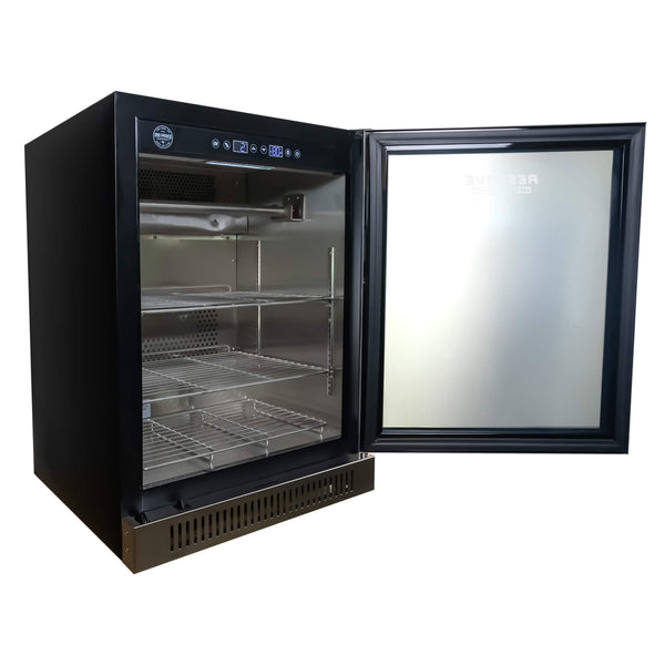 Reserve 100 home dry aging cabinet — angled right interior view with Bacteria Defense UV lighting, meat hooks, and product shelves for aging primal cuts, charcuterie, and cheese