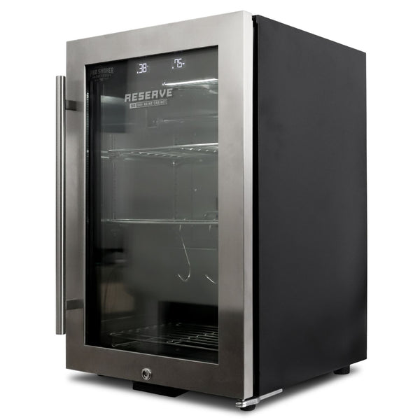Reserve 50 home dry aging cabinet — left side profile showing the stainless steel exterior and compact countertop footprint with locking key