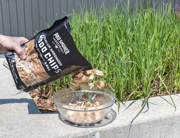 PS Seasoning Pro Smoker premium smoking wood chips — Pecan being put into a bowl