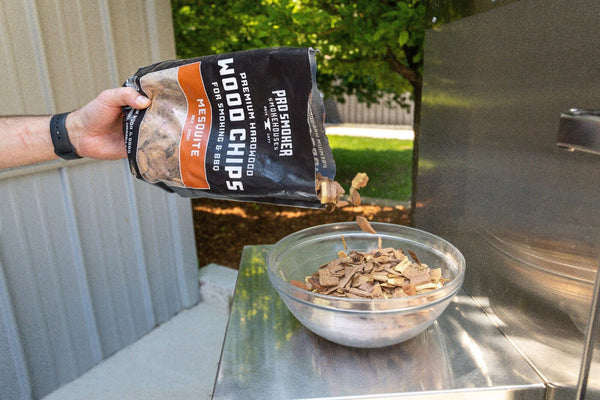 PS Seasoning Pro Smoker premium smoking wood chips — Mesquite being poured into a bowl