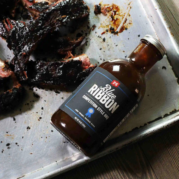 Blue Ribbon - Competition-Style BBQ Sauce with ribs with char bark