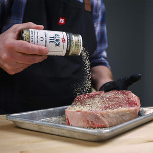 Black Tie Steak Seasoning sprinkled on steak