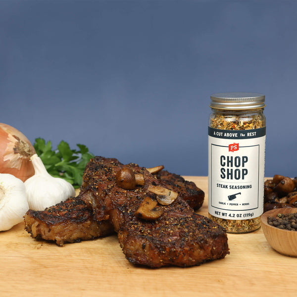 Chop Shop steak seasoning with garlic, pepper, and herbs with steak