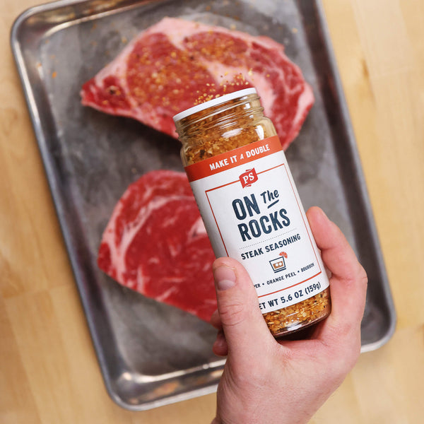 On the Rocks Steak Seasoning shaken on steaks