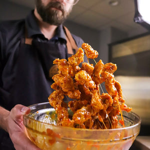 Pineapple Sriracha Wing Sauce tossed with chicken