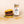 Burger with a jar of 'PS Umami Butter' on a beige background