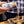 Person sprinkling Umami Butter blend from a jar onto a piece of food.