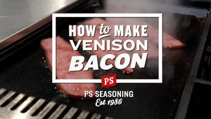 A close-up of bacon cooking on a grill with a large white text overlay reading 'HOW TO MAKE VENISON BACON' 