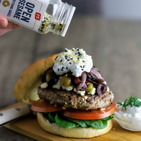 Open Sesane everything bagel seasoning with sesame seeds, onion, and poppy seeds used in a burger