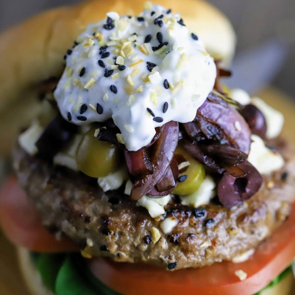 Open Sesane everything bagel seasoning with sesame seeds, onion, and poppy seeds used in a burger