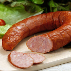 Cut German Bologna on a cutting board.